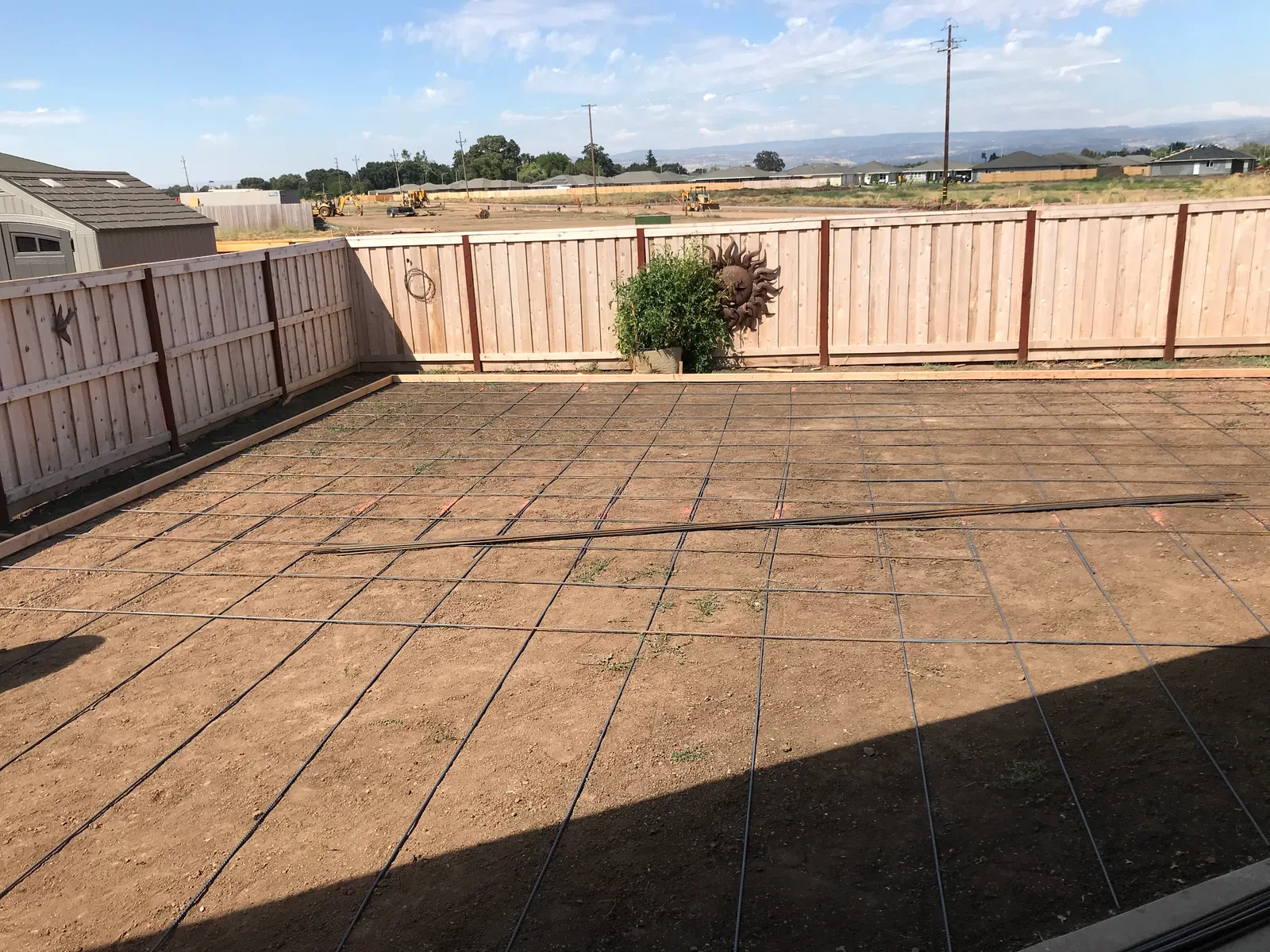 Reinforcement and forms prepared for backyard concrete flatwork